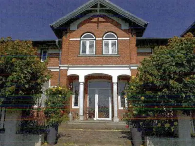Wohnhaus und angrenzendes Wirtschaftsgebäude in Kaisborstel