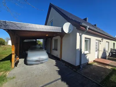 Einfamilienwohnhaus (Doppelhaushälfte) mit Nebengebäuden in Groß Teetzleben