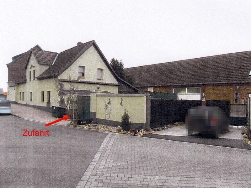 Wohnhaus mit Anbauten und baulichen Außen-/Nebenanlagen in Muldestausee OT Pouch